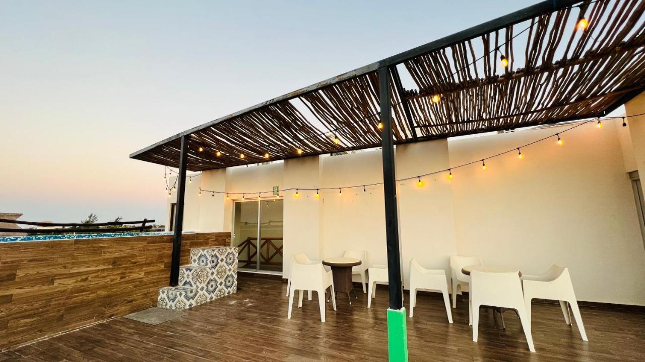 Hotel Mayari Holbox Bagian luar foto Rooftop bar at the hotel